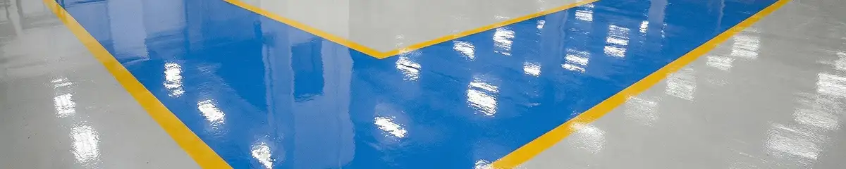 A factory floor professionally covered and marked with epoxy flooring in Tampa, FL