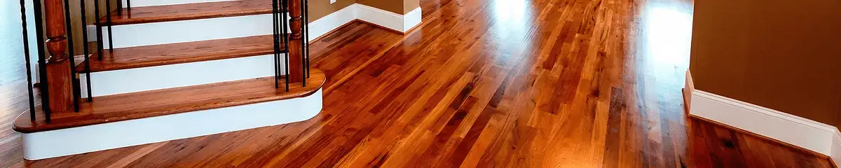 Base floor of a staircase with professionally restored wood flooring in Tampa FL