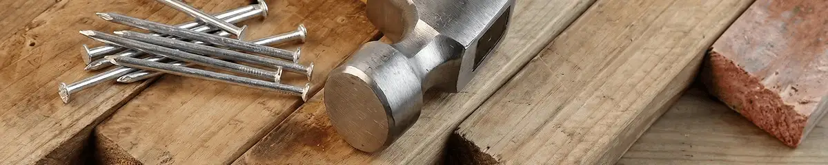 Hammer and nails on hardwood flooring boards in Tampa, FL