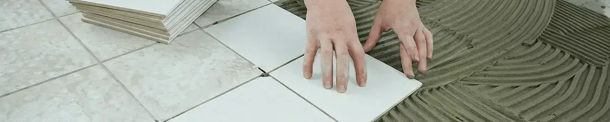 Professional installing white tile floors in Tampa, FL