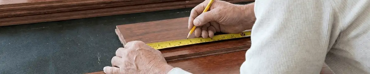 A professional installing wood flooring in Tampa, FL